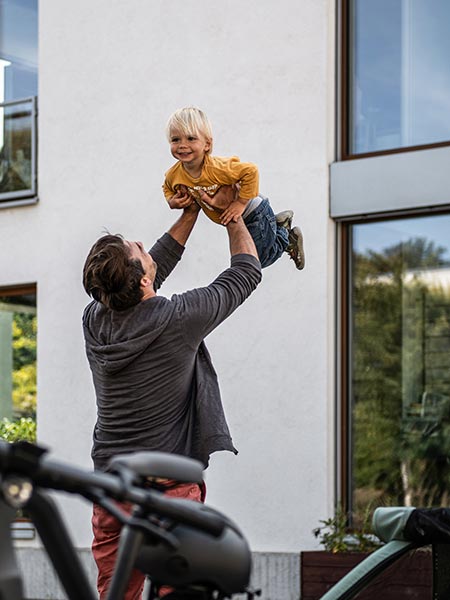 Happy father and little son playing together