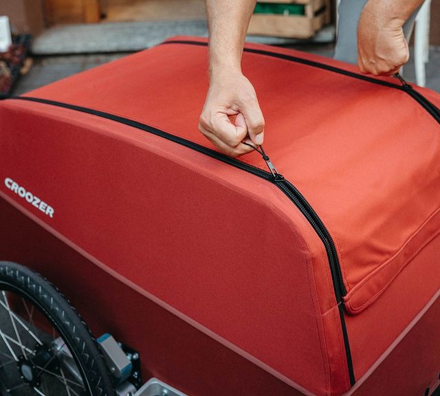 Detailed view of Croozer cargo bike trailer opening and closing system