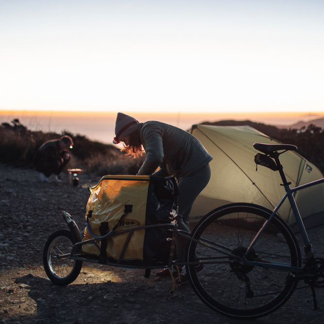 Couple camping outdoors with BOB Ibex / Yak and BOB bag - setting up camp