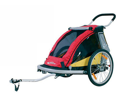 The very first Croozer Kid bike trailer in red and yellow - side view