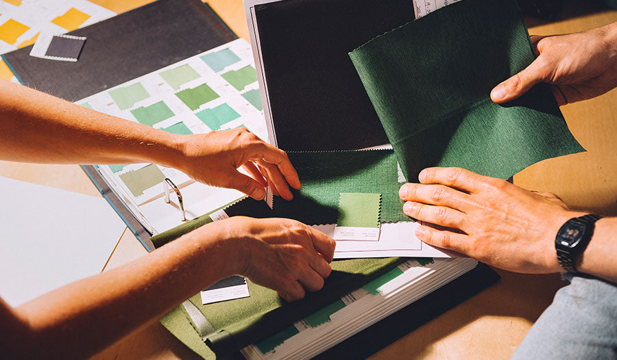 Croozer product development team choosing fabric colors and materials for bike trailer design