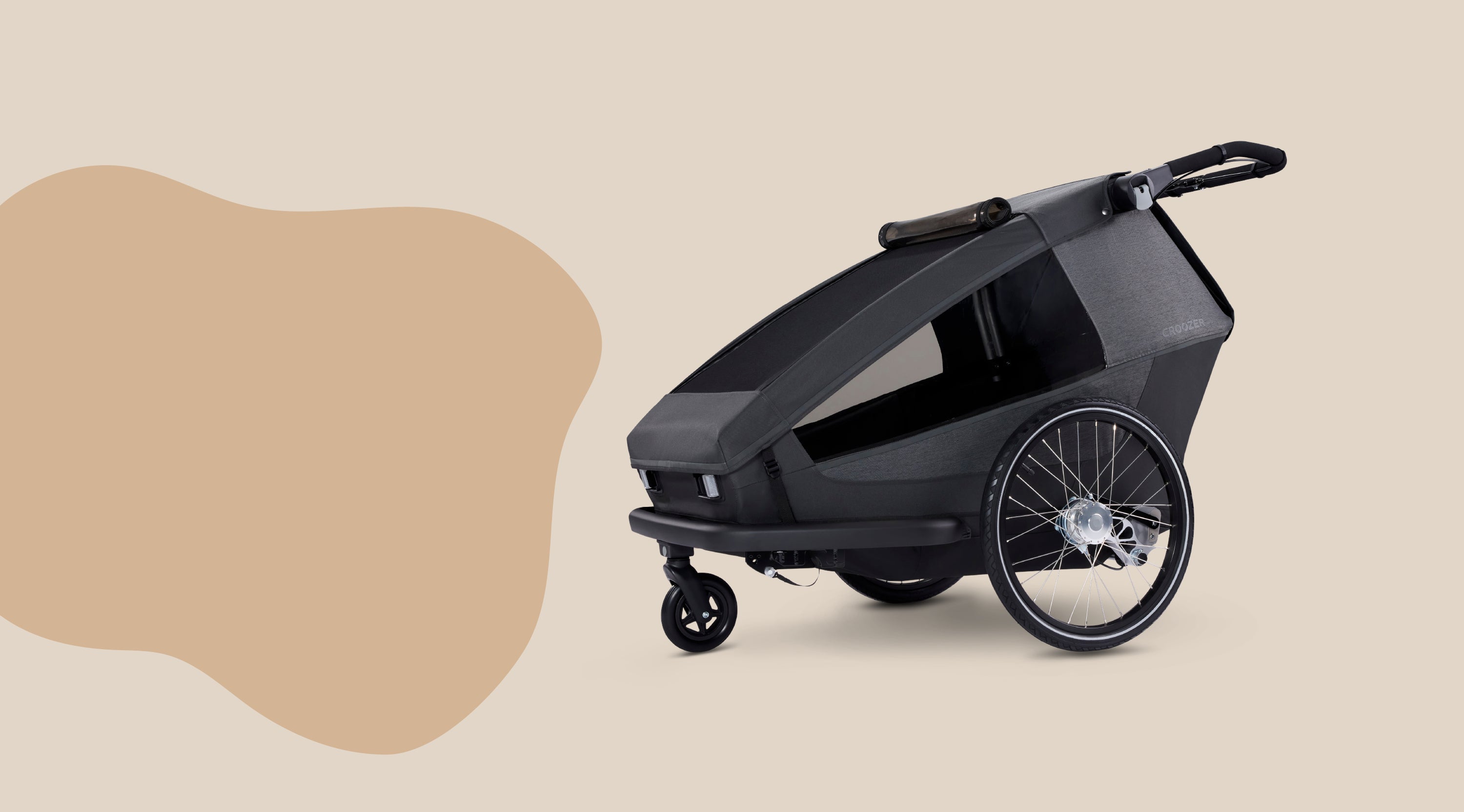 Croozer Yuuna modular bike trailer in stroller mode on minimalist beige background