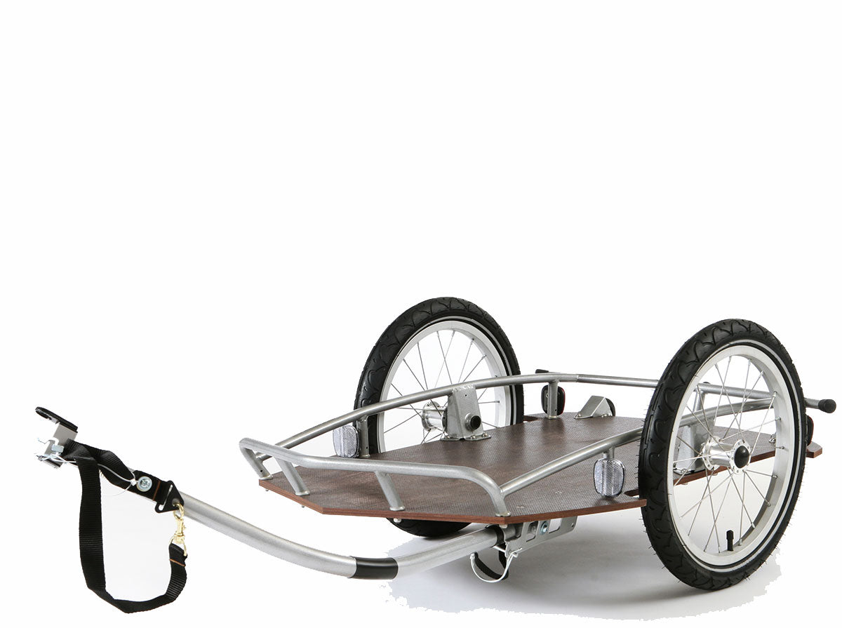 Croozer cargo travel bike trailer with brown wooden platform aluminum frame and two wheels